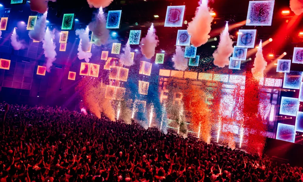 Confetti, lighting and stage production above the crowd at WorldPride Music Festival Amsterdam in 2026.