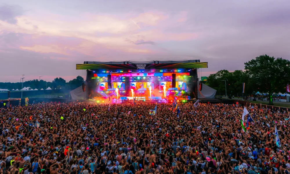 A large crowd faces the main stage at WorldPride Music Festival at the RFK Festival Grounds in Washington, D.C., in 2025.